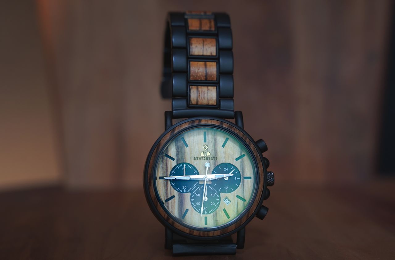 Home Close-up of a stylish wooden wristwatch with detailed chronograph design, perfect for fashion and accessory concepts.